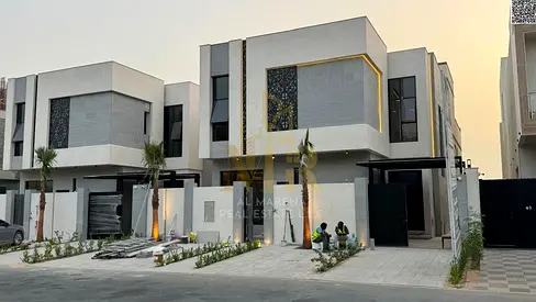 Luxury villa for sale in Al Zahia, Ajman, on Emirates Road exit. Price includes electricity, water, and air conditioning. Freehold ownership.