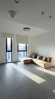 1BR semi-furnished apartment in Aljada with 2 bathrooms, fully equipped kitchen, private parking, sp
