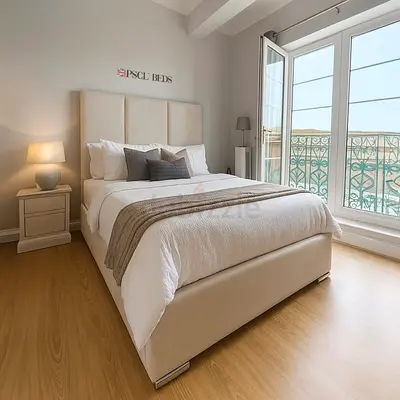 Comfortable Beige Upholstered Double Bed with Headboard