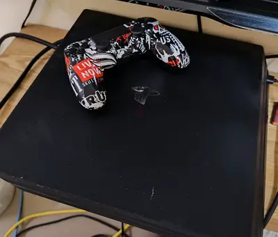 Used ps4 pro with custom modded controller and 4 disc games (spiderman, assassins creed, gow r)