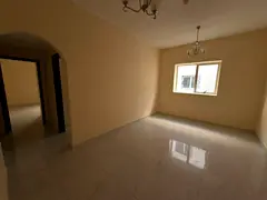 Upscale two-bedroom apartment with a spacious living room for annual rent in the Muwailih area, feat