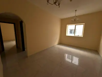Upscale two-bedroom apartment with a spacious living room for annual rent in the Muwailih area, fea