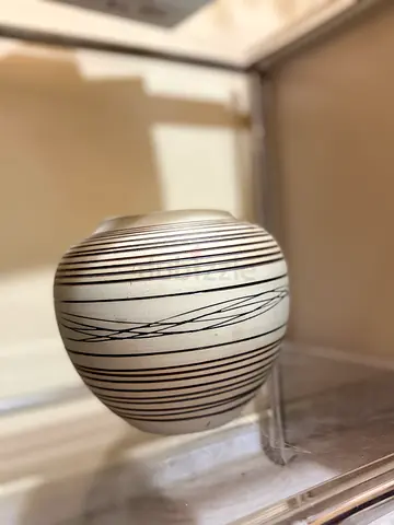 White Ceramic Decorative Vase with Black Linear Pattern