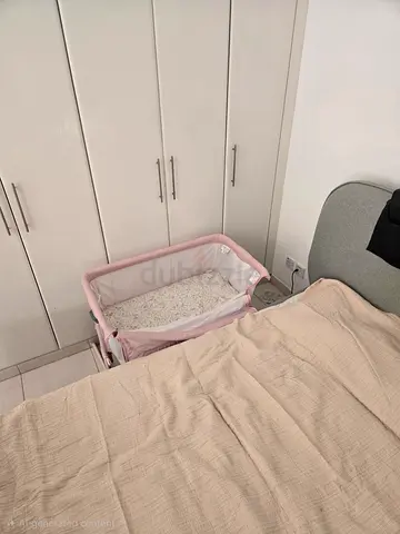 Pink bedside co-sleeper bassinet