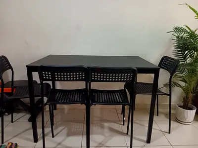 Black dining table with 4 matching chairs - sturdy modern set