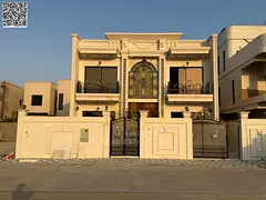 Two-story villa with 5 bedrooms at a special price, including AC fees and charges, in one of Ajman's
