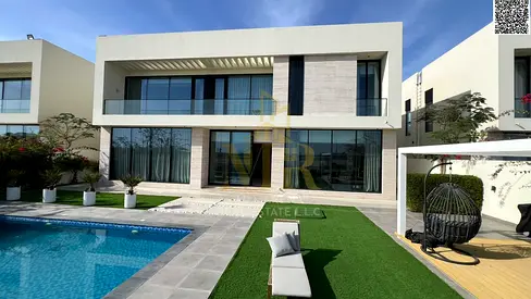 Luxury villa for sale in Al Zorah | Direct golf course | Land area 9,000 sq ft | Fully furnished | 5 bedrooms | Private pool | Outdoor seating area wi