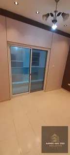 2BR Ajman annual rental, large hall, modern finish, clean, free maintenance, easy Sharjah access, be