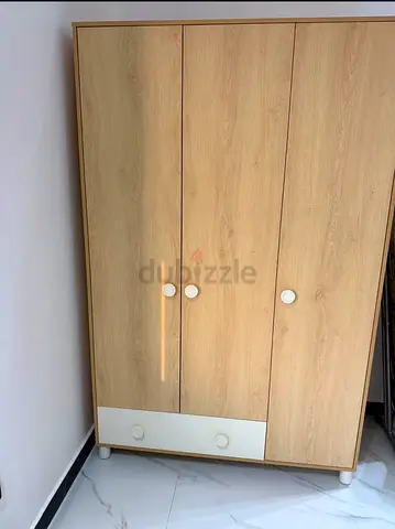 Light wood tall storage cabinet / wardrobe with shelves — good condition