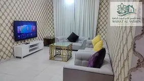 Furnished one-bedroom apartment with a living room for monthly rent in Al Taawun, Sharjah.