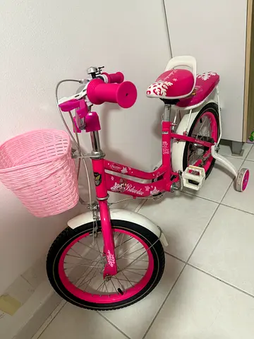 Girls pink 16-inch kids bicycle with training wheels and basket