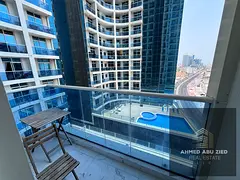 Two luxurious bedrooms and a living room with furnishings. Al Waha Towers - Al Rashidiya 1 | Al Mina