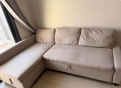 Beige L-shaped Sofa Bed with Storage - Good Condition