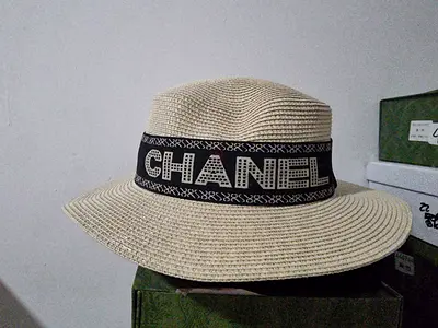 Beige straw Chanel-style wide-brim hat