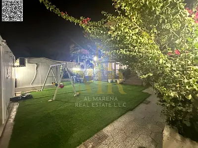 Villa in Al Rawda 1 area, corner plot on two streets, central air conditioning, 5 master bedrooms, facing a mosque, modern design, close to all servic