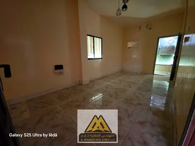 Studio for annual rent in Al Rashidiya 1, Ajman, ground floor, large area, separate kitchen, balcon