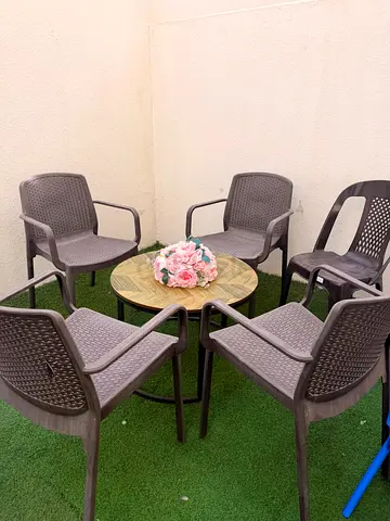 Outdoor Patio Table with 4 Matching Plastic Armchairs - Set of 5