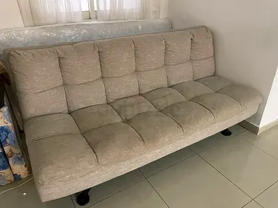 Beige fabric convertible sofa bed - good condition