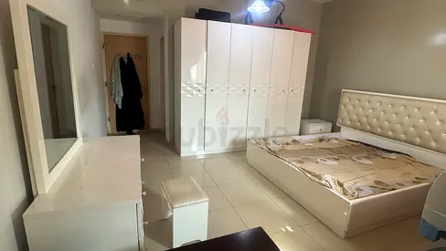 White glossy 6-door wardrobe with matching bed and dresser - set in good condition