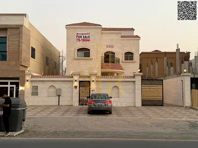 Luxury villa for sale in Al Muwaihat 1 on the main road | 5,000 sq ft | Two floors + roof | 5 master bedrooms | Majlis and living room | Modern kitche