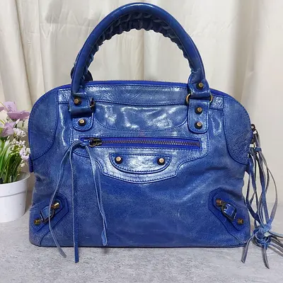 Balenciaga STYLE Distressed Leather bowlers bag