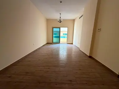 Spacious one-bedroom apartment for annual rent in New Muwaileh | 2 bathrooms | Built-in wardrobes | Balcony | Free parking | Ready to move in