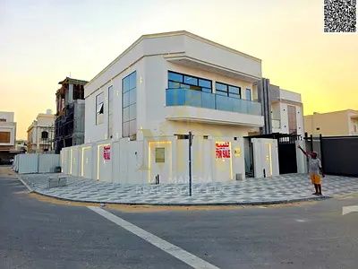 Corner villa for sale in Al Bahia, two floors and a roof, price including registration fees