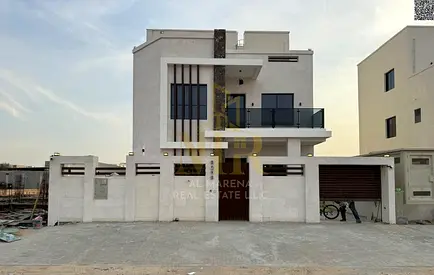A distinctive villa in Al Zahia area, two floors and a roof, with a price including electricity, water and air conditioning fees, on the main street,