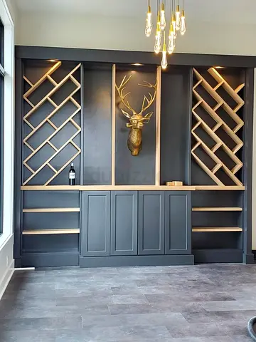 Custom built-in dark grey display cabinet with wine racks and storage