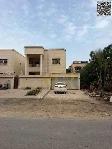 Luxury villa for sale in Al Muwaihat, 2 roofs and spacious areas with a complete family design