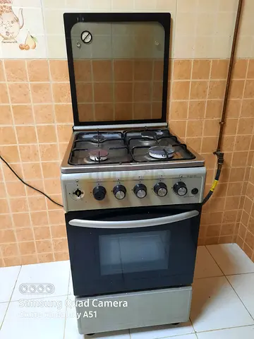 Used freestanding 4-burner gas stove with oven - good working condition