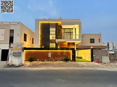 Two-story villa with a roof terrace and four bedrooms in Al Bahia, at a special price including regi