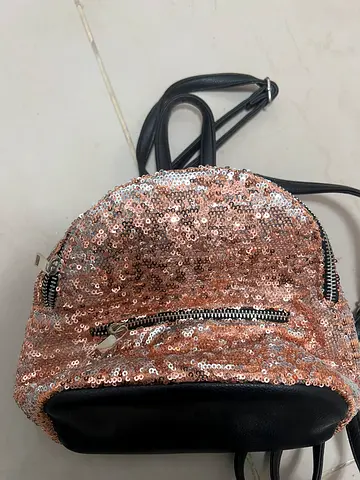 Black bag with rose gold sequence brand alessandro frenza