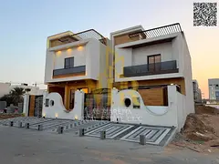 | Own a two-story villa with a rooftop terrace and luxurious finishes in Al Helio 2, Ajman, close to
