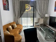 One bedroom and living room with pool view and balcony, furnished with hotel-style furniture, Maryam