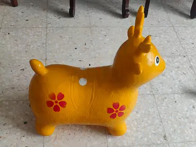 Yellow inflatable/ride-on bouncy animal toy (good condition)