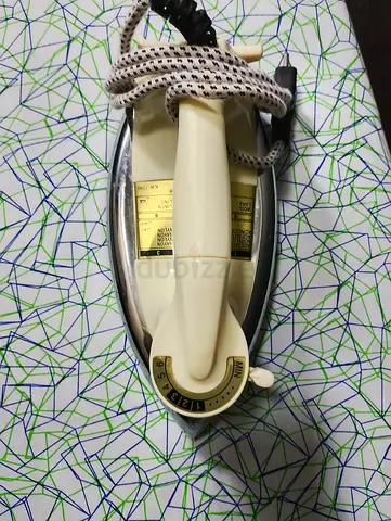 Iron and ironing board both