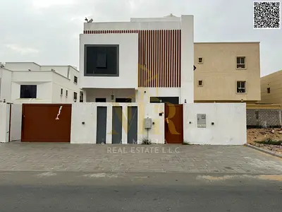 Two-story villa with a roof terrace, 5 bedrooms, at a special price including electricity, water, and air conditioning fees in one of Ajman's most pre