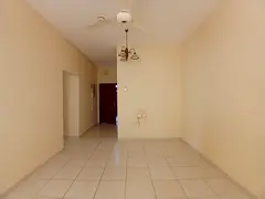 Spacious 2bhk apartment available in window ac central gas family building with balcony in al guwair