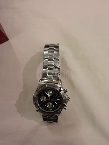 Watch.  CONQUER BRAND