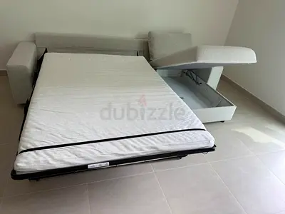 Gunnared beige sofa bed with mattress