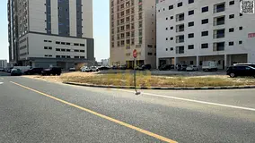 Corner residential/commercial plot for sale in Al Jurf Industrial Area 1, Ajman. Area: 11,000 sq ft.