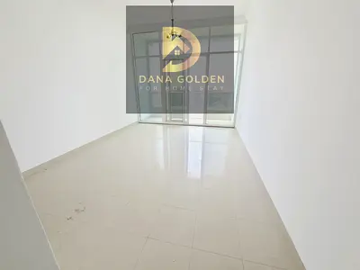 Studio apartment with balcony, gym, and free swimming pool for annual rent in Al Taawun area.