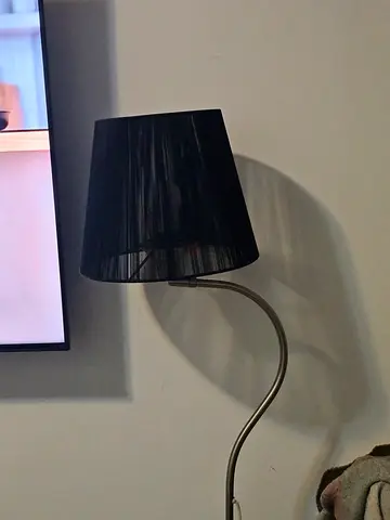 Homecentre Black floor lamp with curved metal arm and fabric shade