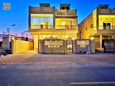 Villa for sale in Ajman: 5 very large master bedrooms with built-in wardrobes, spacious living room with natural ceiling light, Al Helio 2 area.