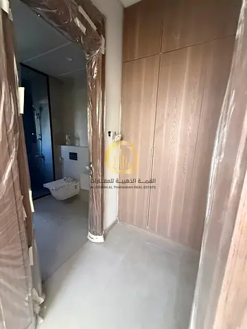 For sale: two attached villas in Al-Houshi, Al-Badiya district, 10,000 sq ft each. Each villa has 4 master bedrooms, 2 kitchens, 2 living rooms, a maj