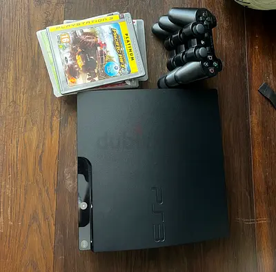 Sony PS3 Slim bundle with 3 DualShock controllers and 4 games