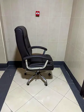 5 Black high-back leather office chair with armrests and wheels