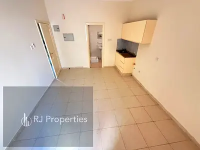 Spacious studio apartment - family building - ready to move - easy access for Dubai