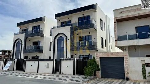 Two-story villa with a rooftop terrace, priced at a special price including registration and ownership fees, in one of Ajman's most prestigious areas.